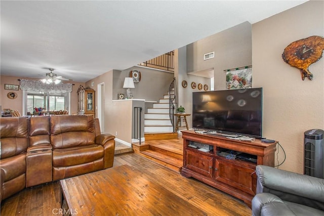 10735 Juniper Ave, Fontana, CA 92337 - living room with hardwood / wood-style floors, stairway, and a ceiling fan