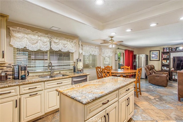 10735 Juniper Ave, Fontana, CA 92337 - kitchen with cream cabinetry, stainless steel appliances, a raised ceiling, ornamental molding, and recessed lighting