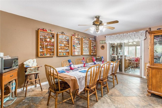 10735 Juniper Ave, Fontana, CA 92337 - dining space with stone tile floors and ceiling fan