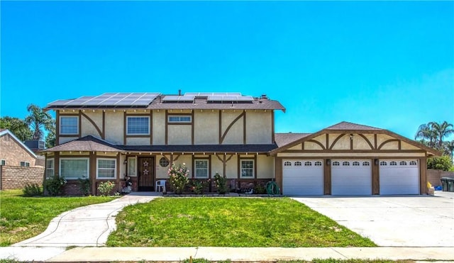 10735 Juniper Ave, Fontana, CA 92337 - english style home featuring stucco siding, an attached garage, driveway, and roof mounted solar panels