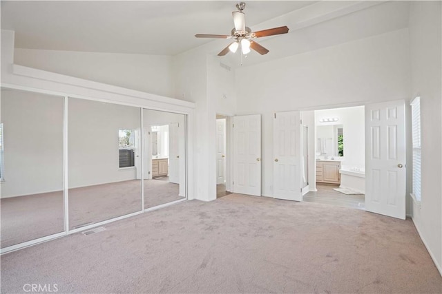 20060 Canyon View Dr, Canyon Country, CA 91351 - unfurnished bedroom with carpet, high vaulted ceiling, connected bathroom, a closet, and ceiling fan