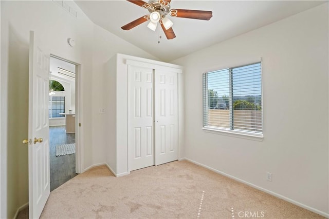 20060 Canyon View Dr, Canyon Country, CA 91351 - unfurnished bedroom with light carpet, vaulted ceiling, a closet, and ceiling fan