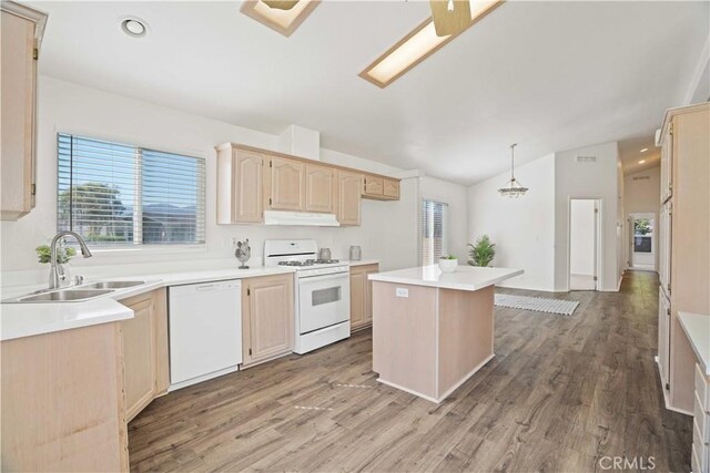 20060 Canyon View Dr, Canyon Country, CA 91351 - kitchen featuring white appliances, under cabinet range hood, light brown cabinets, vaulted ceiling, and wood finished floors
