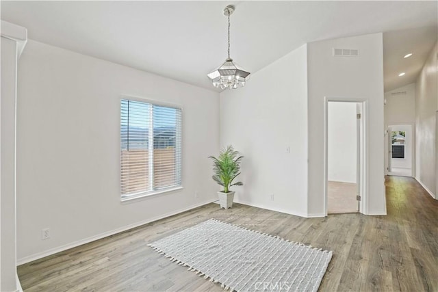 20060 Canyon View Dr, Canyon Country, CA 91351 - spare room with a chandelier, wood finished floors, and recessed lighting