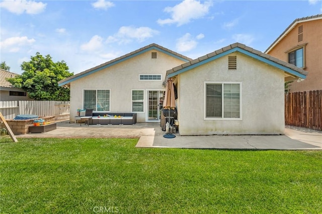 22792 Springdale Dr, Moreno Valley, CA 92557 - back of house with an outdoor living space, a patio, and stucco siding