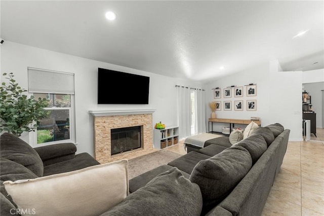 22792 Springdale Dr, Moreno Valley, CA 92557 - living room with light tile patterned floors, a stone fireplace, lofted ceiling, and recessed lighting