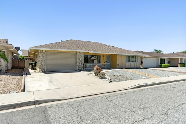 1181 Sandlewood Dr, Hemet, CA 92543 - ranch-style house featuring driveway, a garage, a porch, and stone siding