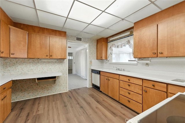 1181 Sandlewood Dr, Hemet, CA 92543 - kitchen featuring white dishwasher, light wood-style floors, light countertops, brown cabinets, and a drop ceiling