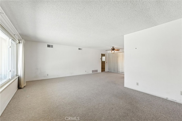 1181 Sandlewood Dr, Hemet, CA 92543 - spare room featuring light carpet, a textured ceiling, and a ceiling fan