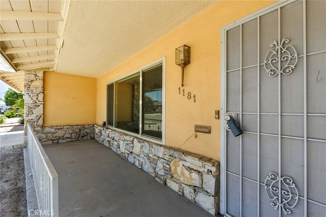 1181 Sandlewood Dr, Hemet, CA 92543 - property entrance with stucco siding and stone siding