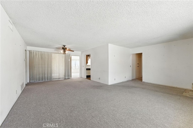 1181 Sandlewood Dr, Hemet, CA 92543 - spare room featuring a ceiling fan, a textured ceiling, and carpet