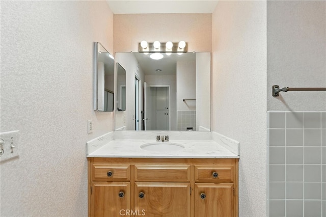 1181 Sandlewood Dr, Hemet, CA 92543 - bathroom with vanity and a textured wall