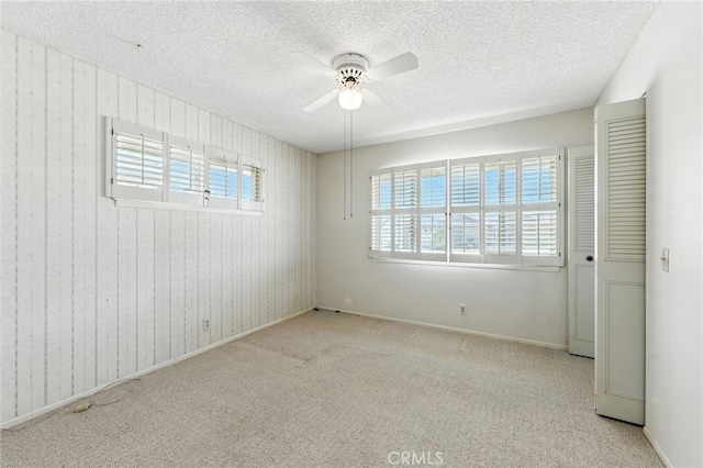 1181 Sandlewood Dr, Hemet, CA 92543 - spare room featuring ceiling fan, a textured ceiling, and carpet floors