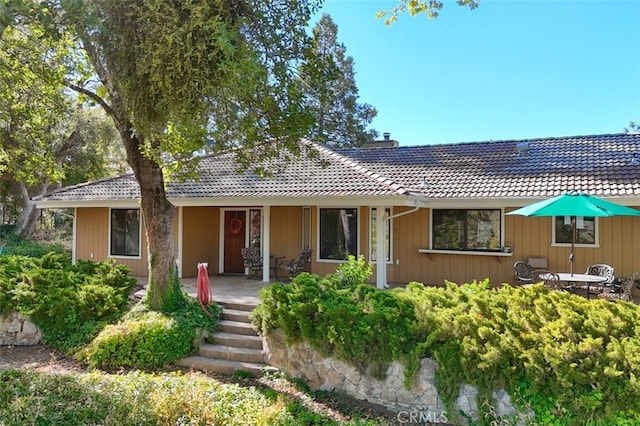 35484 Rd 274, North Fork, CA 93643 - view of front facade with a tile roof, covered porch, and a chimney