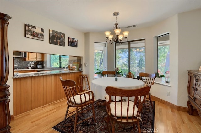 35484 Rd 274, North Fork, CA 93643 - dining area with light wood-style floors and a chandelier