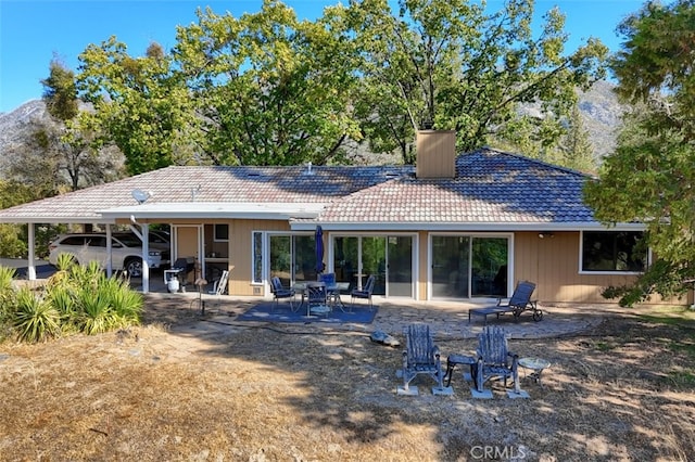 35484 Rd 274, North Fork, CA 93643 - rear view of house with a tile roof and a chimney