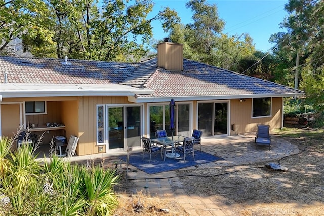 35484 Rd 274, North Fork, CA 93643 - back of house with a chimney, a patio area, and a tile roof