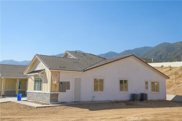 7051 Hurley Ct, San Bernardino, CA 92407 - back of property featuring a mountain view and a tile roof