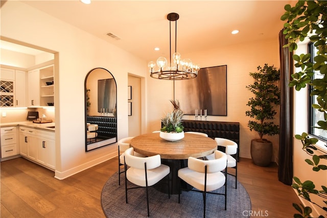7051 Hurley Ct, San Bernardino, CA 92407 - dining area featuring dark wood-type flooring, a chandelier, and recessed lighting