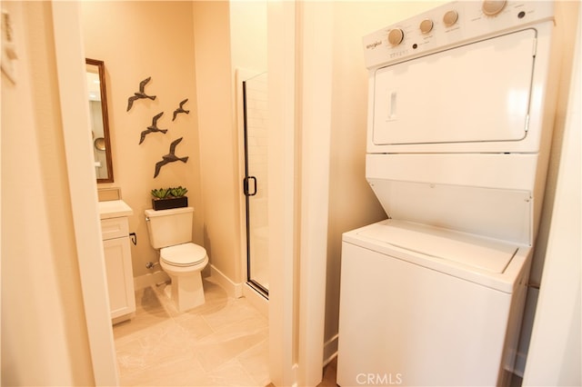 7051 Hurley Ct, San Bernardino, CA 92407 - washroom featuring stacked washer / dryer