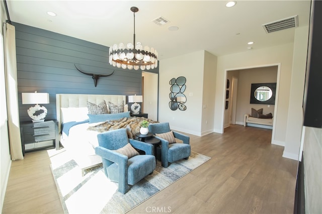 7051 Hurley Ct, San Bernardino, CA 92407 - bedroom featuring recessed lighting, a chandelier, wood finished floors, and wooden walls