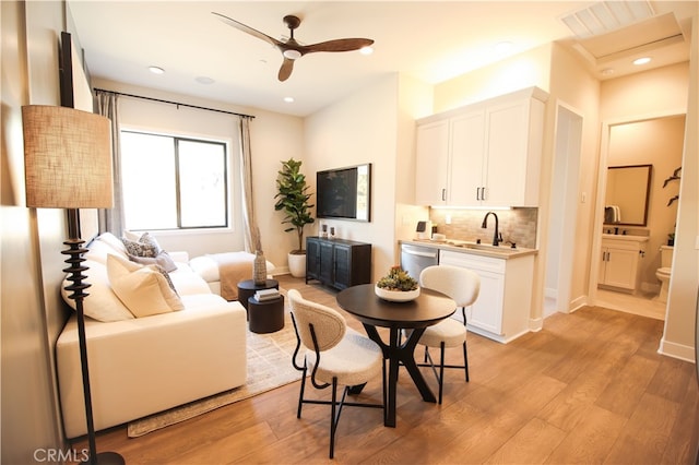 7051 Hurley Ct, San Bernardino, CA 92407 - living room featuring light wood-type flooring, a ceiling fan, and recessed lighting