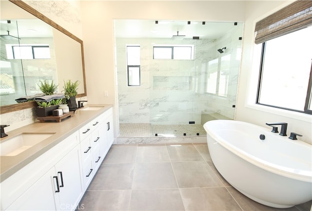 7051 Hurley Ct, San Bernardino, CA 92407 - bathroom with a shower stall, a freestanding tub, double vanity, and tile patterned floors