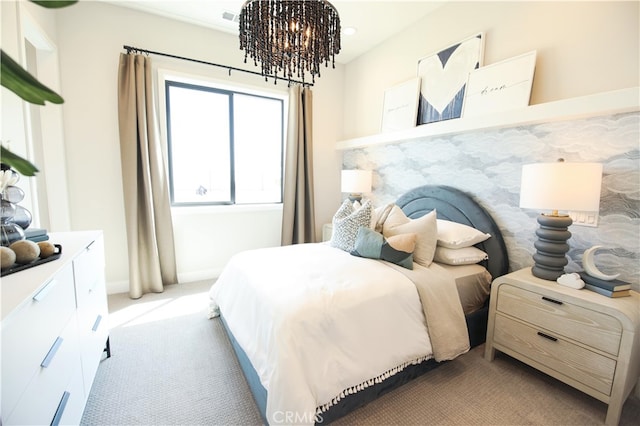 7051 Hurley Ct, San Bernardino, CA 92407 - carpeted bedroom featuring a chandelier and baseboards
