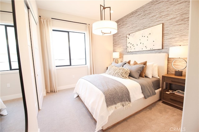 7051 Hurley Ct, San Bernardino, CA 92407 - carpeted bedroom with an accent wall and a closet