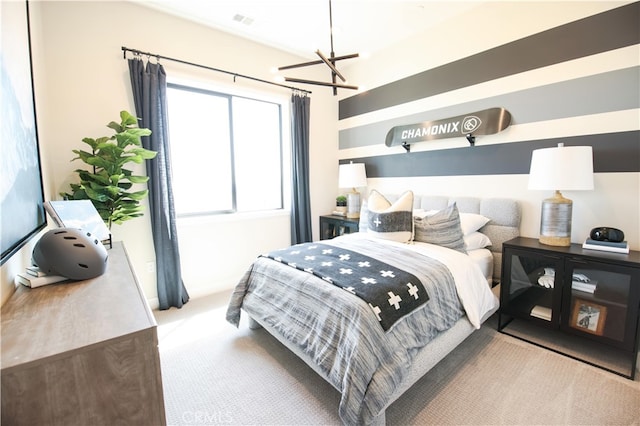 7051 Hurley Ct, San Bernardino, CA 92407 - carpeted bedroom with a chandelier