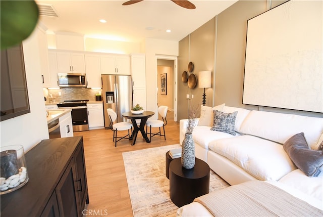 7051 Hurley Ct, San Bernardino, CA 92407 - living room featuring ceiling fan, light wood finished floors, and recessed lighting