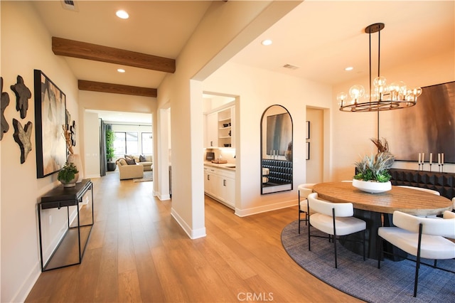 7051 Hurley Ct, San Bernardino, CA 92407 - dining room with light wood finished floors, recessed lighting, beam ceiling, and a chandelier