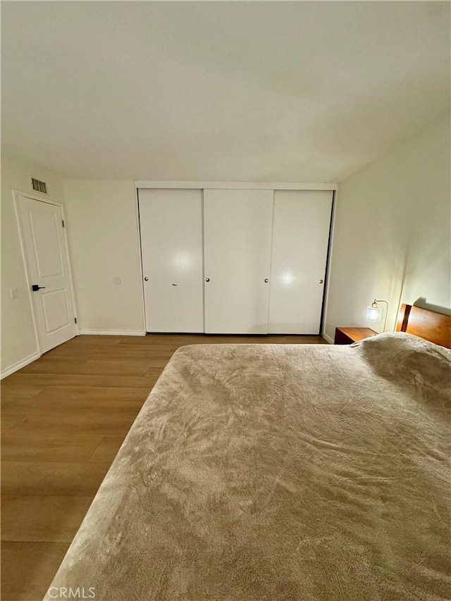 16040 Leffingwell Rd Unit 78, Whittier, CA 90603 - unfurnished bedroom featuring wood finished floors and baseboards