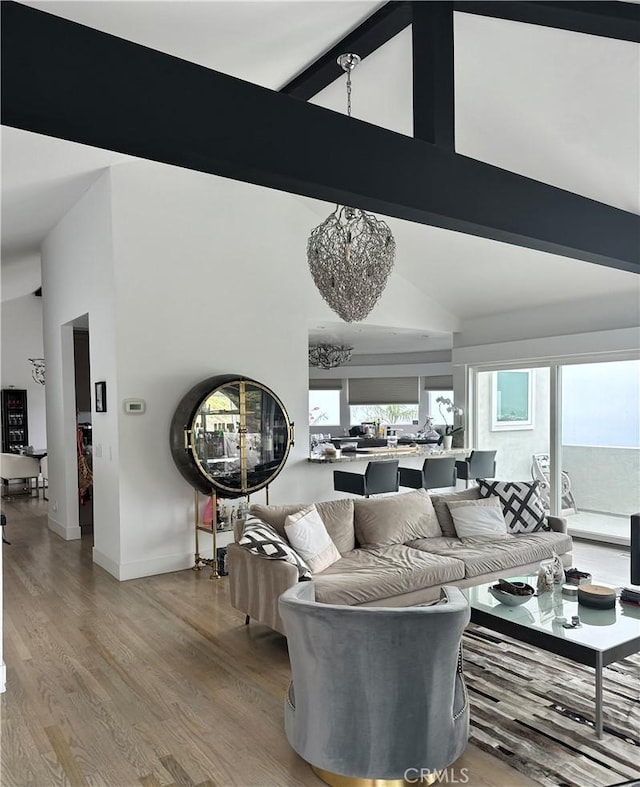 766 Pelican Dr, Laguna Beach, CA 92651 - living area with high vaulted ceiling, light wood finished floors, and beamed ceiling