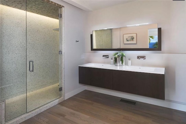 766 Pelican Dr, Laguna Beach, CA 92651 - full bathroom with wood finished floors, double vanity, and a stall shower