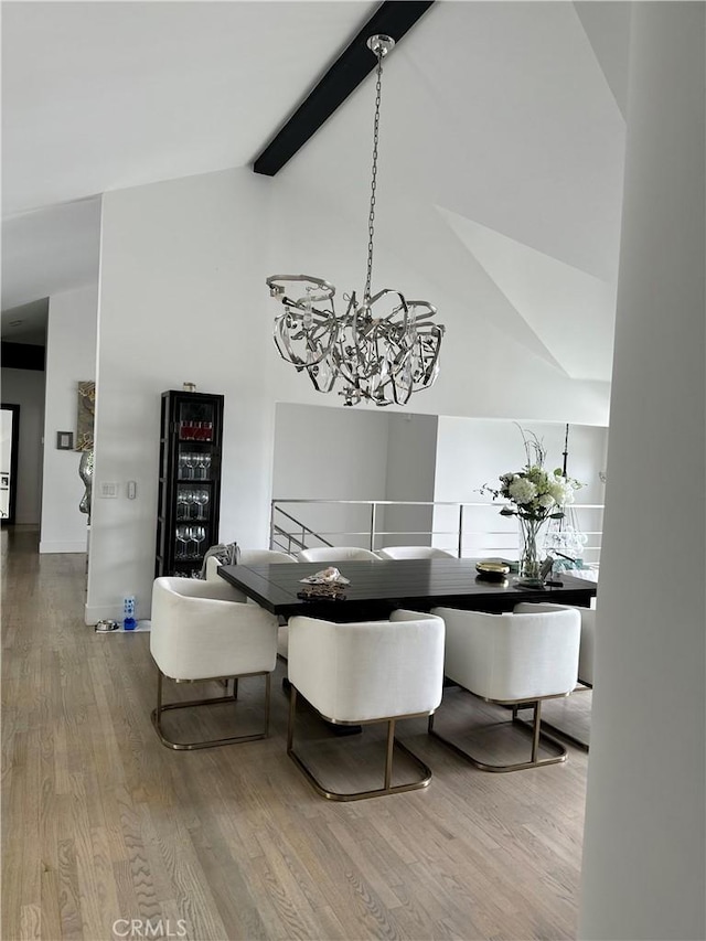 766 Pelican Dr, Laguna Beach, CA 92651 - dining area featuring a chandelier, wood finished floors, high vaulted ceiling, and beamed ceiling