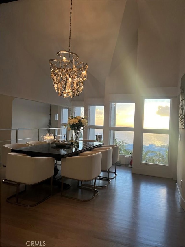 766 Pelican Dr, Laguna Beach, CA 92651 - dining space featuring a high ceiling, a chandelier, wood finished floors, and healthy amount of natural light