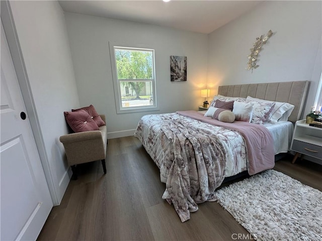 1598 W 7th St, San Bernardino, CA 92411 - bedroom featuring dark wood-style flooring