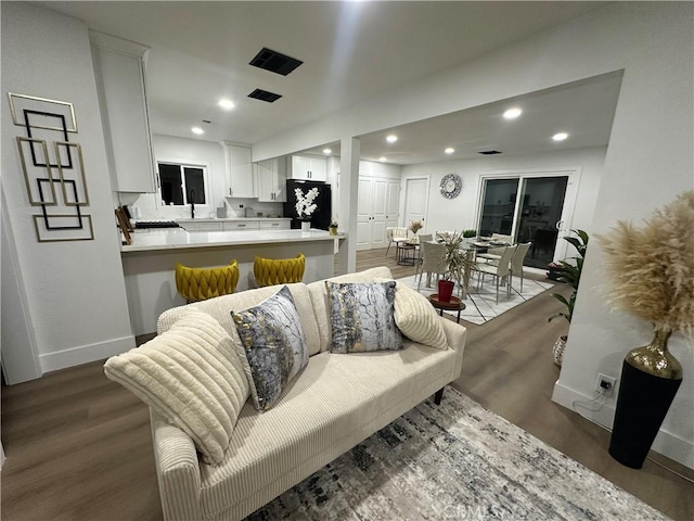 1598 W 7th St, San Bernardino, CA 92411 - living area with wood finished floors and recessed lighting
