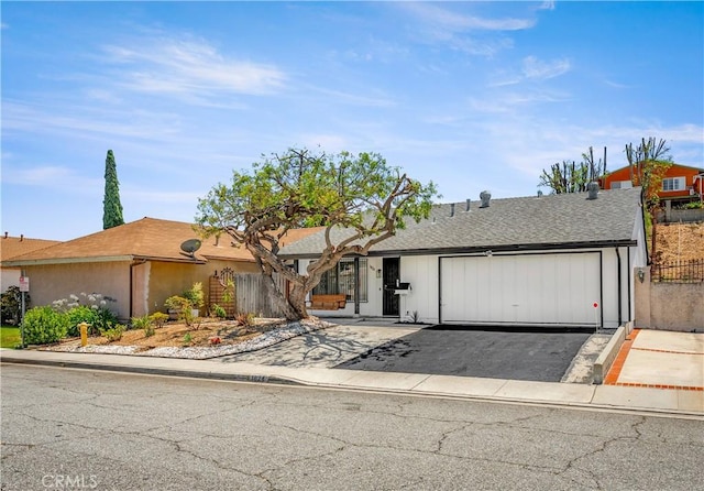 1824 Greenleaf Dr, West Covina, CA 91792 - ranch-style home with asphalt driveway, a garage, and a shingled roof