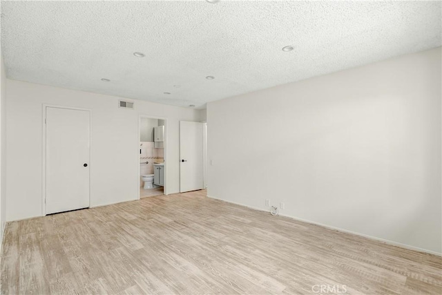 1824 Greenleaf Dr, West Covina, CA 91792 - unfurnished room featuring light wood finished floors and a textured ceiling