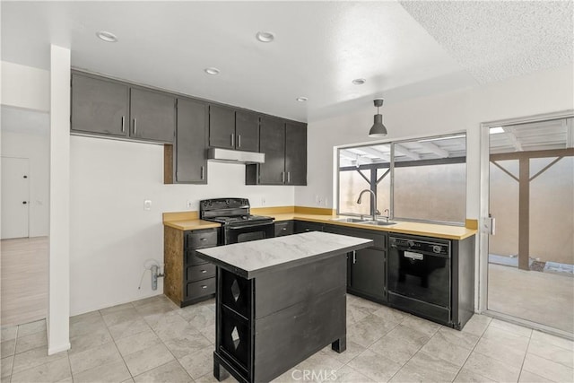 1824 Greenleaf Dr, West Covina, CA 91792 - kitchen with black appliances, under cabinet range hood, light countertops, a center island, and dark cabinetry