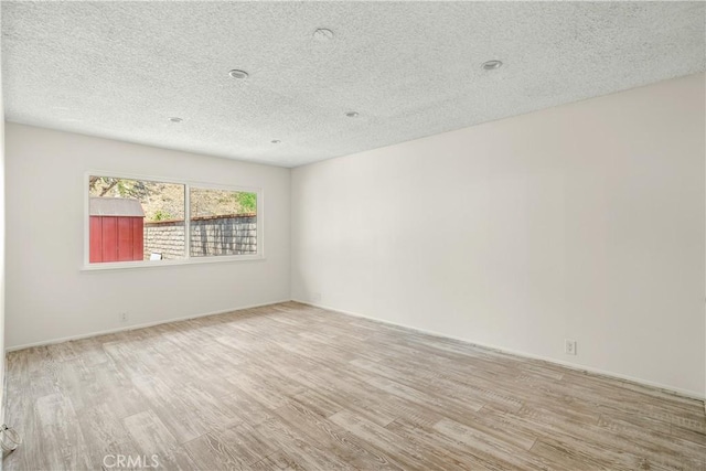1824 Greenleaf Dr, West Covina, CA 91792 - unfurnished room featuring wood finished floors and a textured ceiling