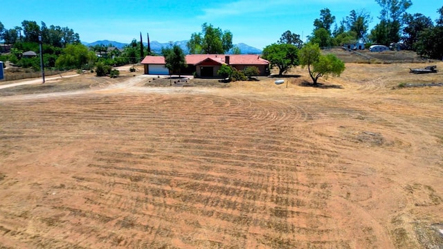 700 Ash St, Ramona, CA 92065 - view of yard with a mountain view and a garage