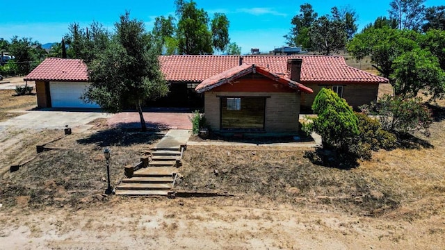 700 Ash St, Ramona, CA 92065 - view of front of house with a tile roof, a garage, and a chimney