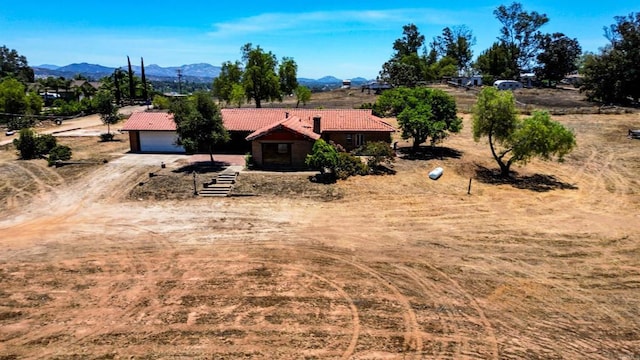 700 Ash St, Ramona, CA 92065 - view of front of home featuring a tile roof, a mountain view, driveway, and a garage