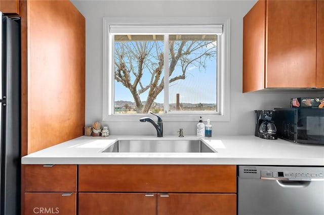 2654 Olympic Rd, Joshua Tree, CA 92252 - kitchen featuring dishwasher, plenty of natural light, black microwave, and light countertops