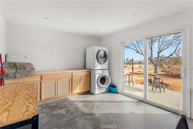 2654 Olympic Rd, Joshua Tree, CA 92252 - washroom with estacked washer and dryer and cabinet space