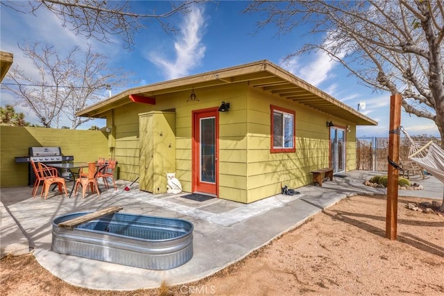 2654 Olympic Rd, Joshua Tree, CA 92252 - rear view of house featuring a patio area and outdoor dining space