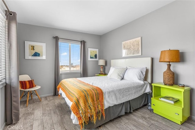 2654 Olympic Rd, Joshua Tree, CA 92252 - bedroom featuring wood finished floors and baseboards